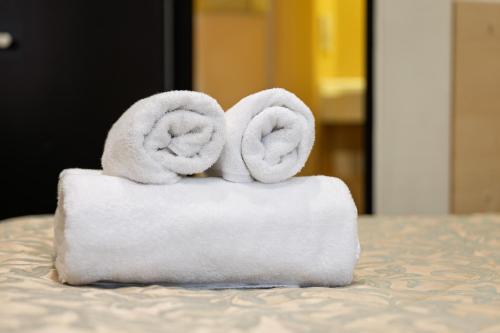a stack of towels sitting on top of a table at St George Hotel Paddington in London