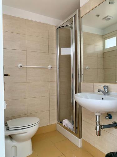 a bathroom with a toilet and a sink at Residencial do Vale in Funchal