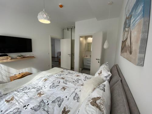 a dog laying on a bed in a bedroom at Ady13 Vendégház Eger in Eger