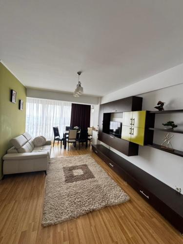 a living room with a couch and a table at Class Belvedere Apartments in Oradea