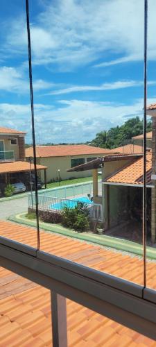 a view of a pool from a balcony at LardoceLar in Camaçari