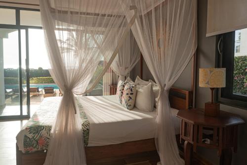Llit o llits en una habitació de Kena Beach Villas