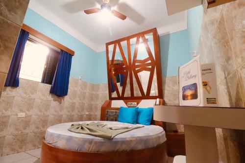 a room with a bed and a mirror at Hotel Bellamy in São Paulo