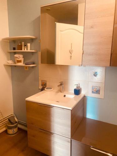 a kitchen with a sink and a counter top at Au Cœur d Etaples in Étaples