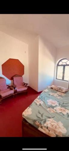 a bedroom with a bed and a window in it at Westernmagic in Idukki