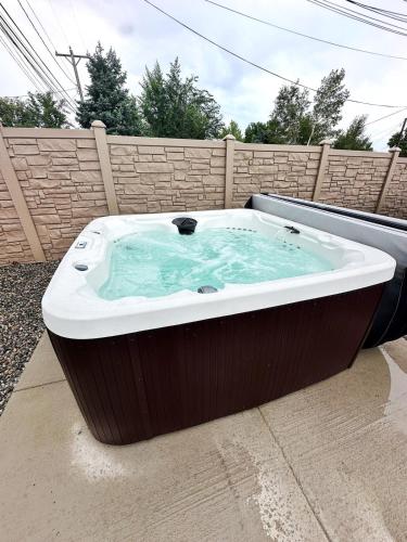 a large hot tub sitting in a backyard at Urban Float in Colorado Springs