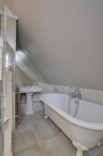 a bathroom with a large tub and a sink at 2 Bed in Tunbridge Wells oc-tw660 in Royal Tunbridge Wells