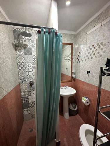a bathroom with a shower and a sink at Hospedaje San Vicente in San Vicente
