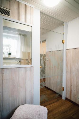 a room with a mirror and a door in a room at Ferienwohnung Gierschner in Kronach