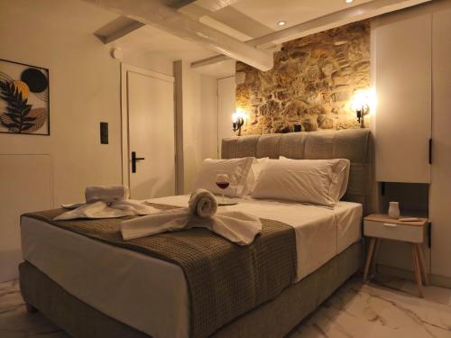 a bedroom with a bed with a towel on it at Castle View Serenity in Koroni