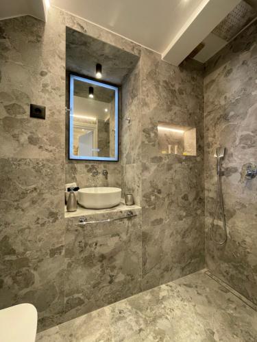 a bathroom with a sink and a mirror at Castle View Serenity in Koroni