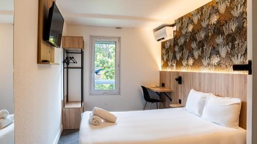 Krevet ili kreveti u jedinici u okviru objekta Quick Palace Anglet