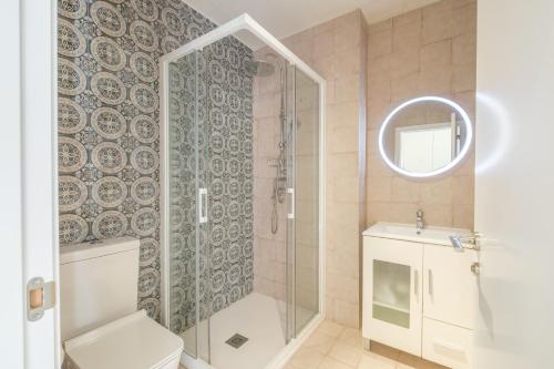 a bathroom with a shower and a toilet and a sink at Gorgeous Apt with a Large Private Terrace in Valencia
