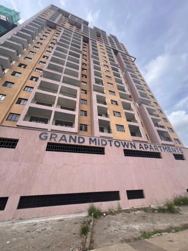 a tall building with the words grand midtown apartment at Kwetu properties in Nairobi