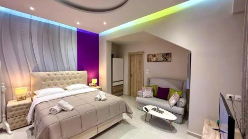 a bedroom with a large bed and a rainbow at Aggelos Room 3 in Volos