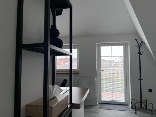 a white room with a desk and a window at Vila SoHo in Vysoké Mýto