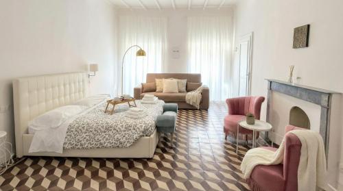 a living room with a bed and a fireplace at Allegra Toscana - Affittacamere Guest house Arezzo in Arezzo