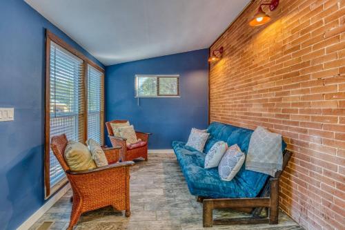 a living room with a blue couch and chairs at The Rosemont Estate in Florence