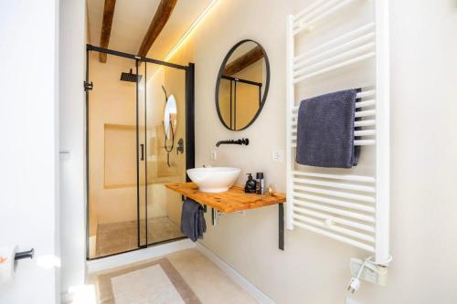 a bathroom with a sink and a mirror at Casa Puresa in Artá