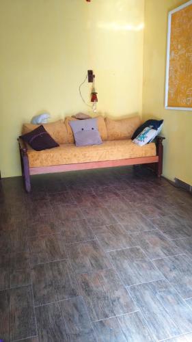 a couch in a room with a laptop on it at Habitación en Casa Museo in Villa Garibaldi