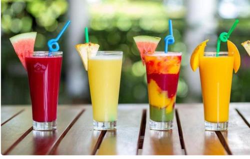 a group of four drinks sitting on a table at Icon Hotel in Kampala