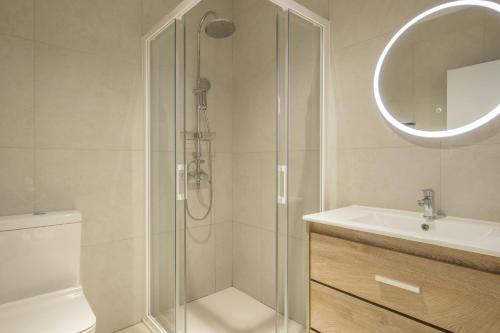 a bathroom with a shower and a toilet and a sink at Chic & Comfortable Apartment, Private Terrace in Valencia