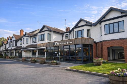 a row of buildings with a store at Beverley Hotel in Walsall