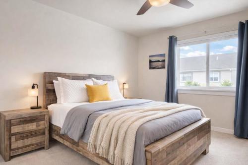 a bedroom with a large bed and a window at Mountain View Haven in Belgrade in Belgrade