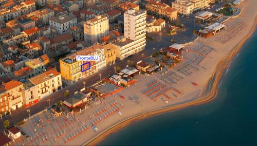 an aerial view of a beach with buildings and the ocean at Fronte BLU - FRONTE MARE in Porto Recanati