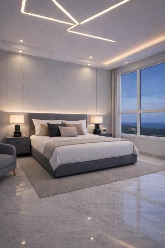 a bedroom with a large bed with two lamps and a window at Malaga palace in Soûr