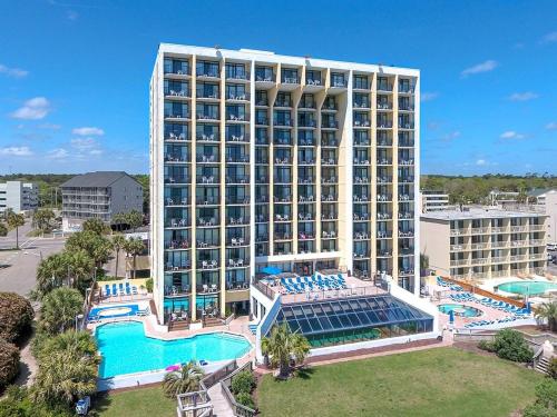 a large hotel with a pool and a resort at Oceanfront Suite, Seascape Sanctuary at OceanPark! 1104 in Myrtle Beach