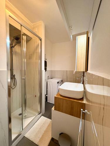 a bathroom with a shower and a sink and a toilet at Maison Lake Maggiore Art Stay,central Baveno, 60 mt from Lake and Hotel Dino Congress Center in Baveno