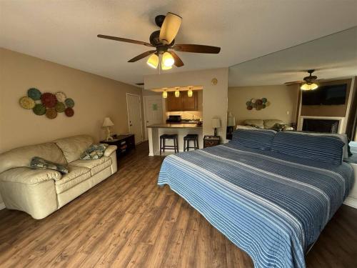 a large bedroom with a bed and a couch at Rivers Edge 803c in Helen