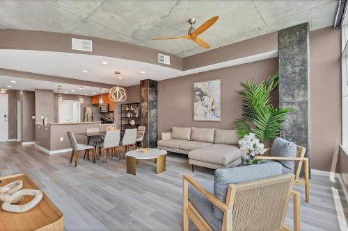 a living room with a couch and a table at Spacious Apartment Masterfully Decorated in Orlando