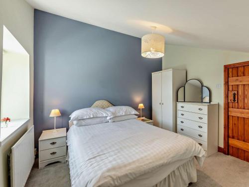a bedroom with a large bed and two night stands at 2 Bed in Keswick oc-sz145 in Braithwaite