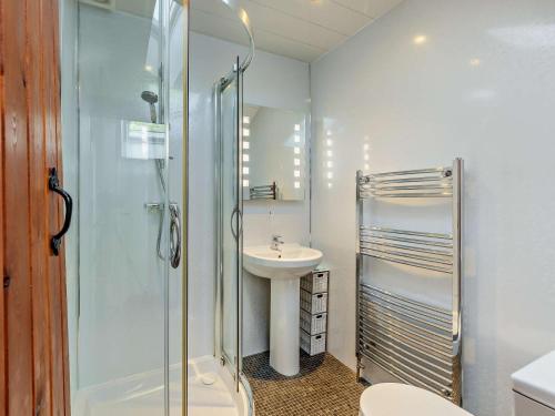 a bathroom with a shower and a sink and a toilet at 2 Bed in Keswick oc-sz145 in Braithwaite