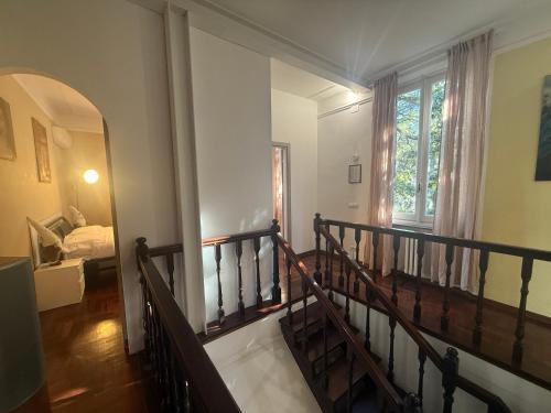 a room with a staircase leading to a bedroom at Garden suite / del ducato in Parma