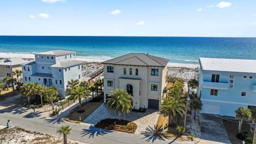 an aerial view of a house next to the beach at Honeysuckle Blue in Pensacola Beach
