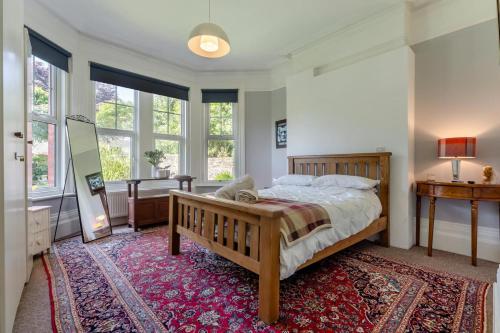a bedroom with a large bed and a rug at 2 Bed in Bexhill-on-Sea oc-t29534 in Bexhill