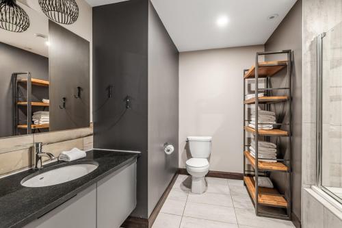 a bathroom with a sink and a toilet at Blanc40 in Stoneham