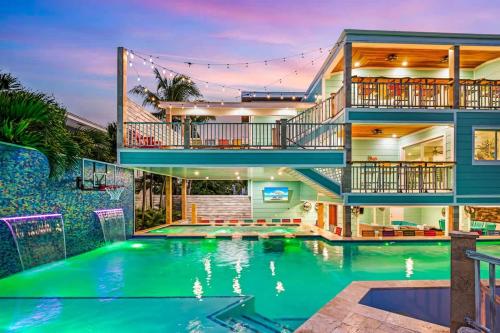 an exterior view of a house with a swimming pool at Bumpa's Big House in Marathon