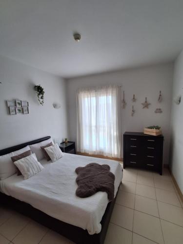 Llit o llits en una habitació de Vila Verde Ficus
