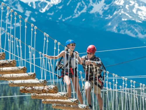 two children on a suspension bridge in the mountains at Vantage Point in Vail