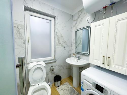 Vannas istaba naktsmītnē NVater Apartment