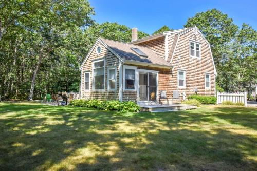 a house with a large lawn in front of it at Large Great Location Dog Friendly in Dennis