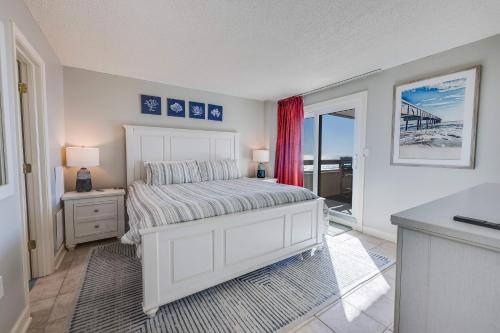 a bedroom with a white bed and a window at Sea Pointe 2BR Condo Oceanview, Views, Large Condo in Myrtle Beach