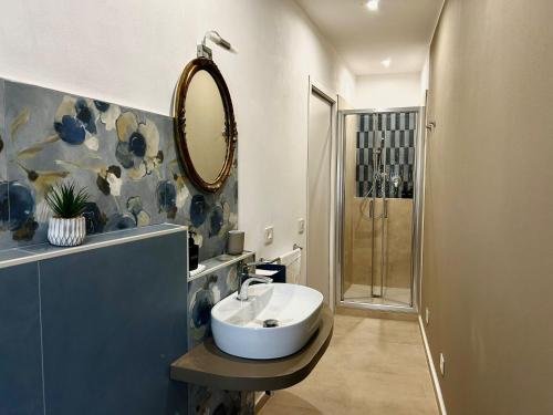 a bathroom with a sink and a mirror at Atelier Salvetti in Colle di Val d'Elsa