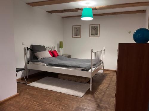 a bedroom with a white bed in a room at Ferienhaus Früh am See in Fürstenwerder