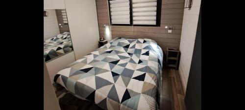 a bedroom with two beds in a room at Chalet contemporain in Carnac