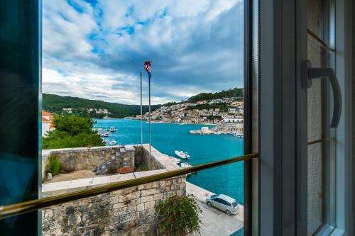 a view of a harbor from a window at Rooms Bed and Breakfast Blanc in Pučišća